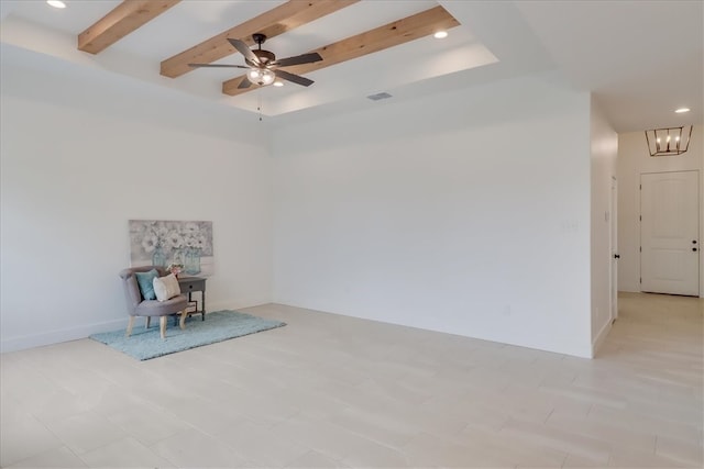 unfurnished room featuring beamed ceiling and ceiling fan