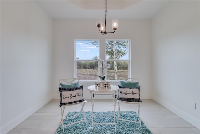 sitting room with a chandelier and light tile patterned floors