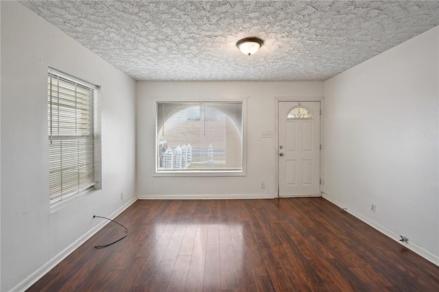 foyer entrance featuring dark hardwood / wood-style floors