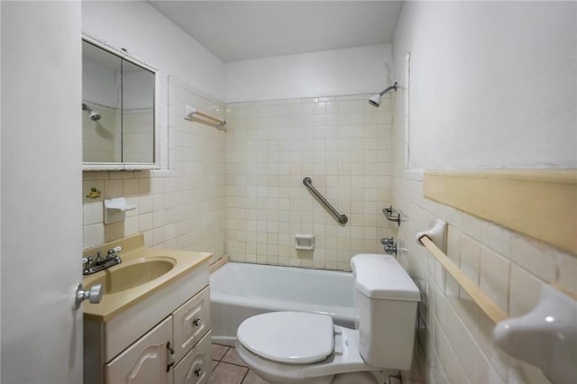 full bathroom featuring tile patterned flooring, vanity, tile walls, and toilet