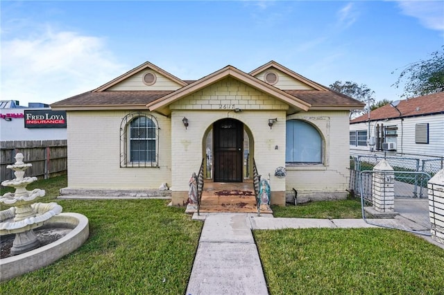 view of front of home with a front lawn