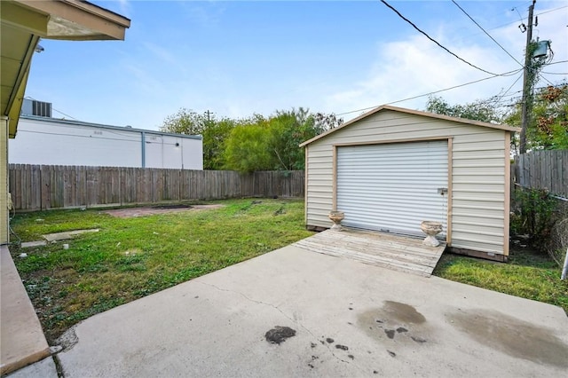 garage featuring a lawn