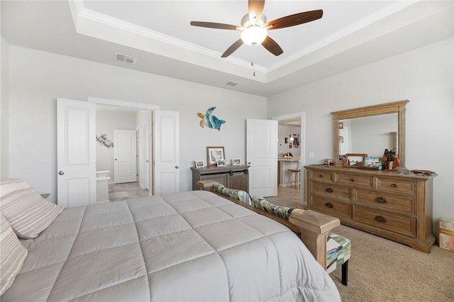 bedroom featuring light colored carpet, a raised ceiling, ceiling fan, and ornamental molding