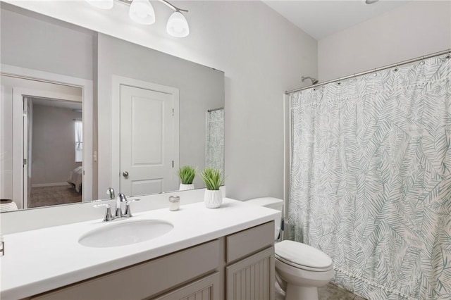 bathroom with vanity and toilet