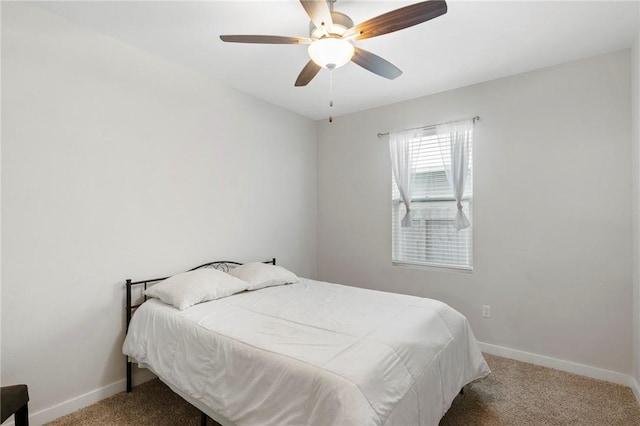 bedroom with ceiling fan and carpet floors