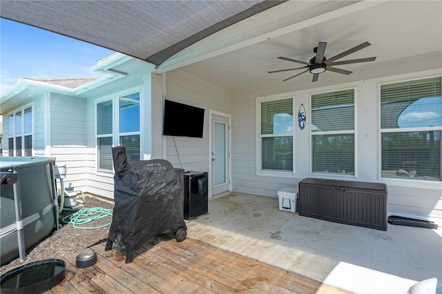 view of patio / terrace with a deck and ceiling fan