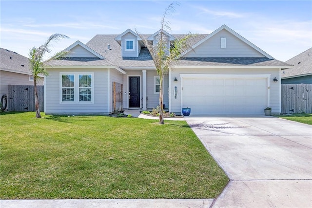 view of front of property with a garage and a front yard