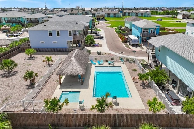 235 Port Mansfield St, Port Aransas, TX 78373 - aerial perspective of suburban area with a pool