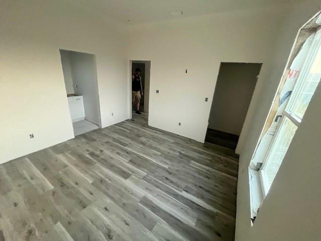 interior space featuring wood finished floors and a healthy amount of sunlight