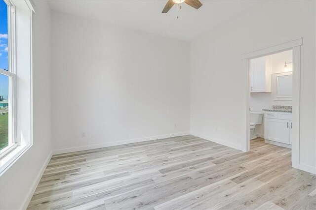 235 Port Mansfield St, Port Aransas, TX 78373 - spare room featuring a ceiling fan, light wood-type flooring, and baseboards