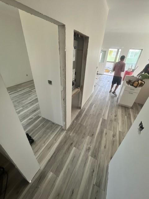 corridor featuring wood finished floors