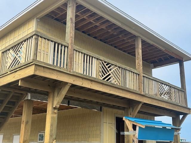 view of side of home featuring a balcony