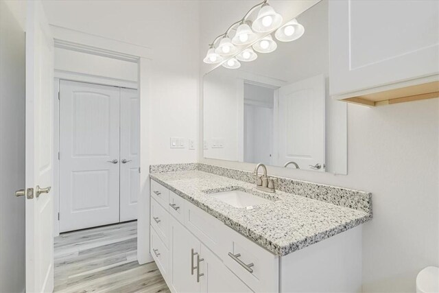 235 Port Mansfield St, Port Aransas, TX 78373 - bathroom with vanity and wood finished floors