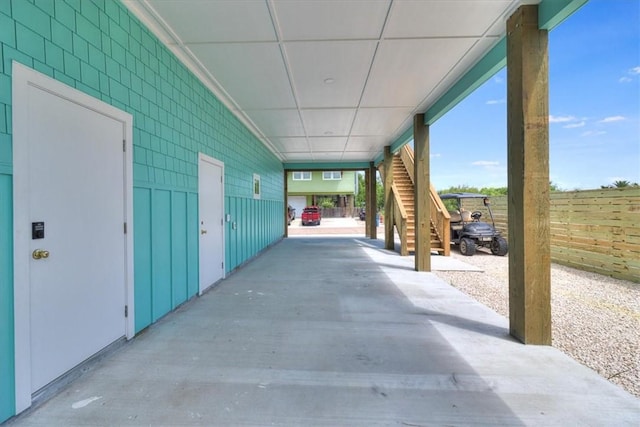 235 Port Mansfield St, Port Aransas, TX 78373 - view of patio / terrace featuring a carport and stairway