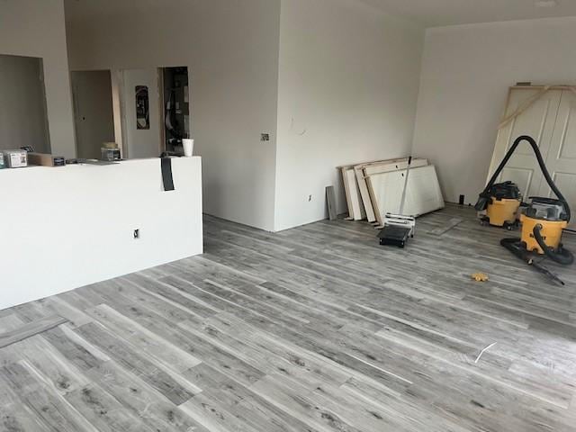 unfurnished room with wood finished floors