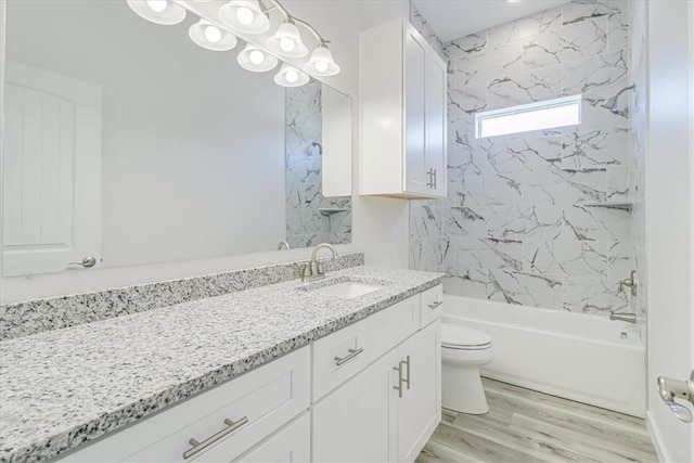 235 Port Mansfield St, Port Aransas, TX 78373 - full bathroom with vanity, toilet, shower / bathtub combination, and wood finished floors