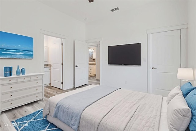 235 Port Mansfield St, Port Aransas, TX 78373 - bedroom featuring light wood-type flooring and ensuite bathroom