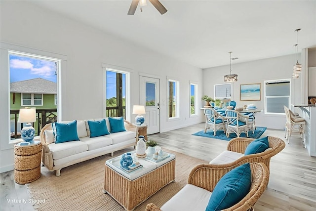 235 Port Mansfield St, Port Aransas, TX 78373 - living area featuring a ceiling fan and light wood-style floors