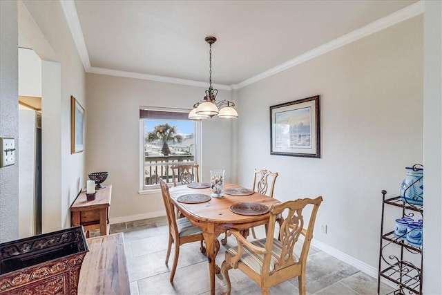 dining space featuring ornamental molding and baseboards