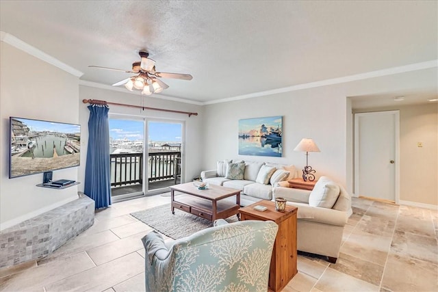 living room featuring ornamental molding, a textured ceiling, and a ceiling fan