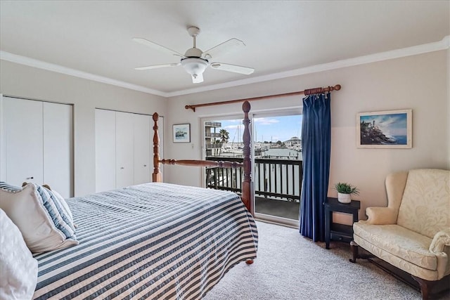 bedroom with a ceiling fan, multiple closets, access to exterior, ornamental molding, and carpet