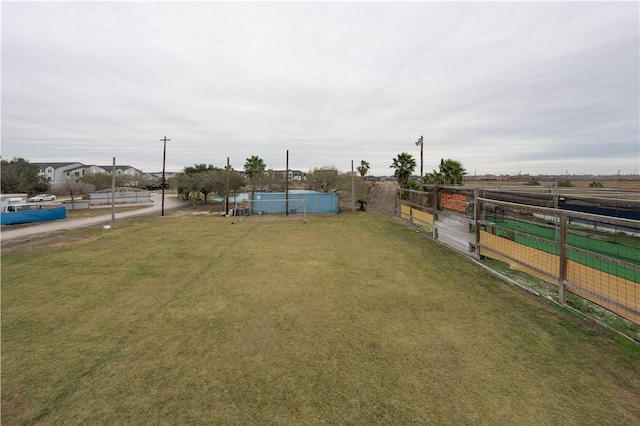 view of yard featuring a pool