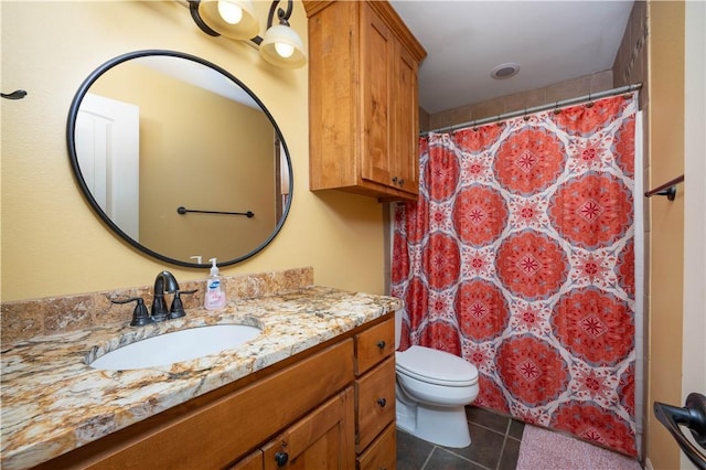 bathroom with tile patterned flooring, vanity, a shower with shower curtain, and toilet