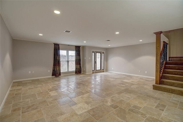 unfurnished room with crown molding