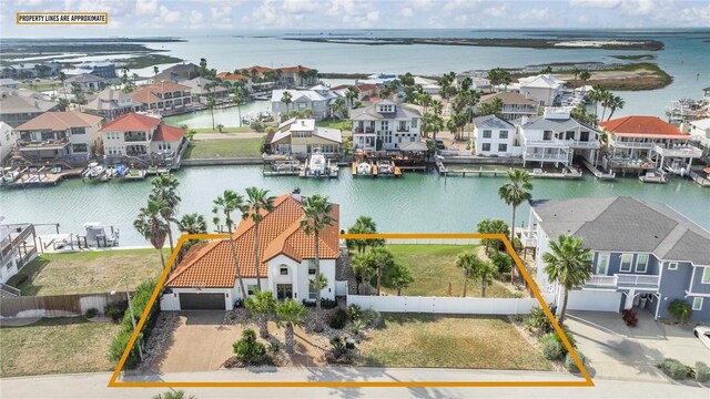 bird's eye view with a residential view and a water view