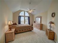 15230 Isabella Ct, Corpus Christi, TX 78418 - bedroom featuring vaulted ceiling and light carpet