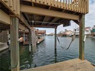 15230 Isabella Ct, Corpus Christi, TX 78418 - dock area featuring a water view and boat lift