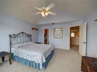 15230 Isabella Ct, Corpus Christi, TX 78418 - bedroom featuring lofted ceiling, carpet flooring, and a ceiling fan