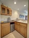 15230 Isabella Ct, Corpus Christi, TX 78418 - kitchen featuring recessed lighting and brown cabinets