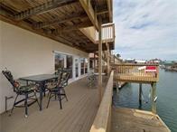 15230 Isabella Ct, Corpus Christi, TX 78418 - dock featuring a water view and outdoor dining area