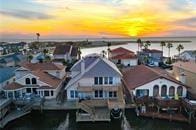 15230 Isabella Ct, Corpus Christi, TX 78418 - aerial view at dusk of a water view and a residential view