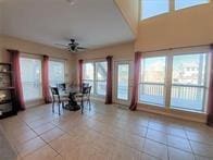 15230 Isabella Ct, Corpus Christi, TX 78418 - dining space featuring light tile patterned floors and a ceiling fan