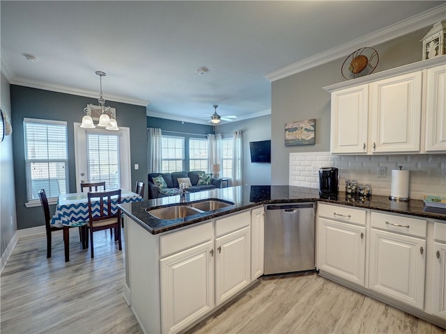 kitchen featuring white cabinets, crown molding, light wood-type flooring, and dishwasher