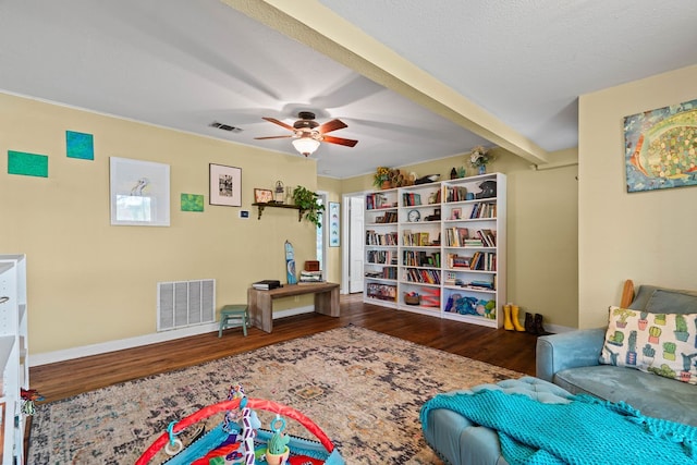 interior space with ceiling fan and dark hardwood / wood-style floors