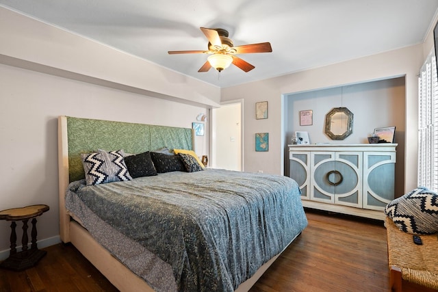 bedroom with dark wood-type flooring, multiple windows, and ceiling fan