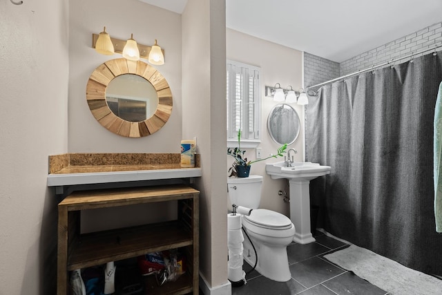 bathroom featuring a shower with curtain, tile patterned floors, toilet, and sink