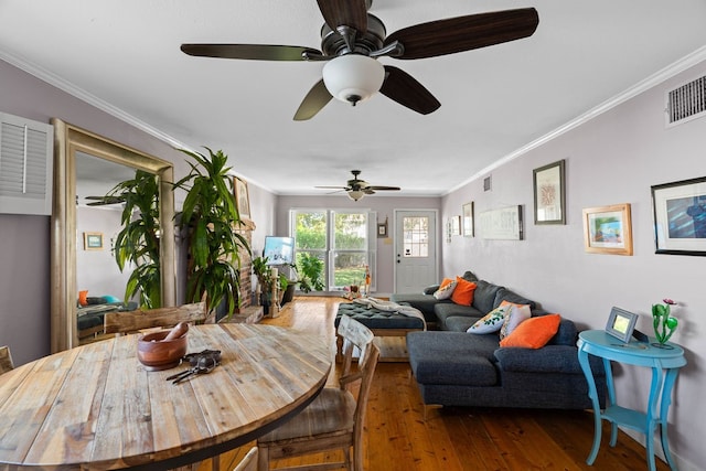 dining room with hardwood / wood-style flooring, ceiling fan, and crown molding