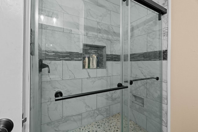 bathroom featuring an enclosed shower