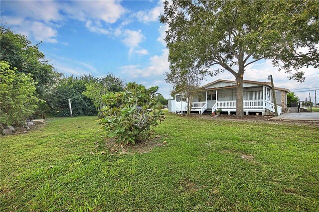 342 Davis Rd, Taft, TX 78390 - view of grassy yard featuring a porch