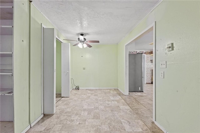 342 Davis Rd, Taft, TX 78390 - spare room featuring a ceiling fan and a textured ceiling