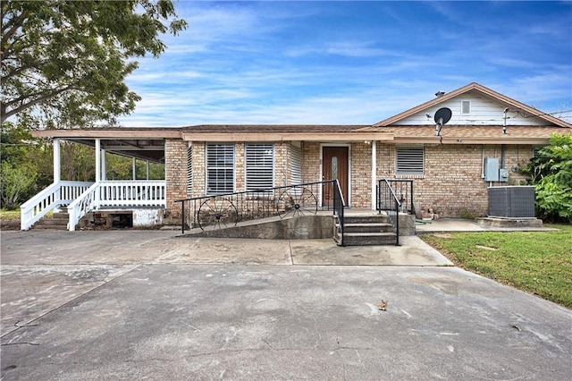 342 Davis Rd, Taft, TX 78390 - view of front of property featuring covered porch and brick siding