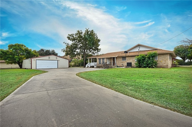 single story home featuring a garage, an outdoor structure, central air condition unit, and a front yard