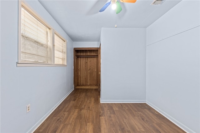 interior space featuring ceiling fan and dark hardwood / wood-style flooring