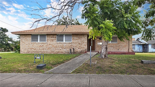 view of front of home with a front yard