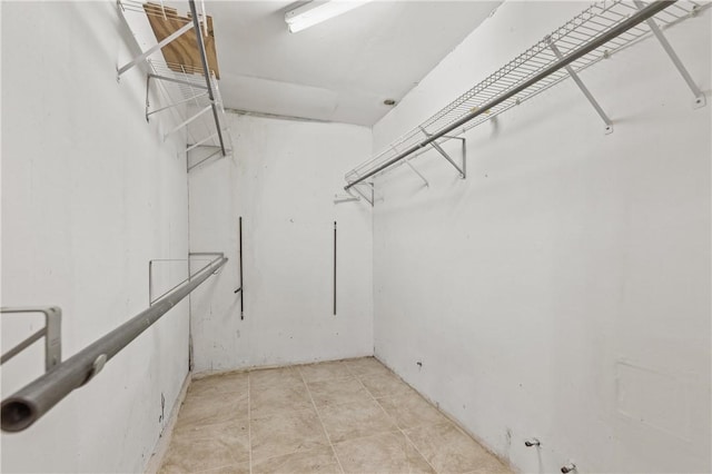 342 Davis Rd, Taft, TX 78390 - walk in closet featuring light tile patterned flooring