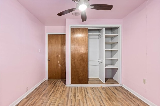 342 Davis Rd, Taft, TX 78390 - unfurnished bedroom featuring wood finished floors, a ceiling fan, and a closet